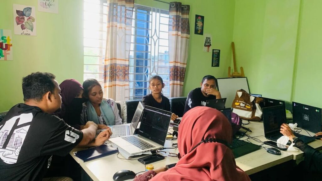 The grafillia marketing agency team member with workspace